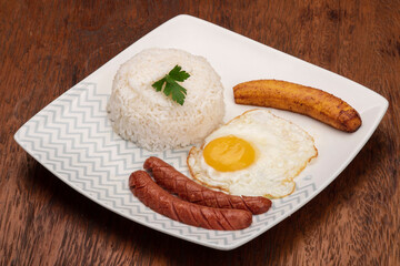 typical Brazilian dish, diced meat, rice, fried egg and fried banana