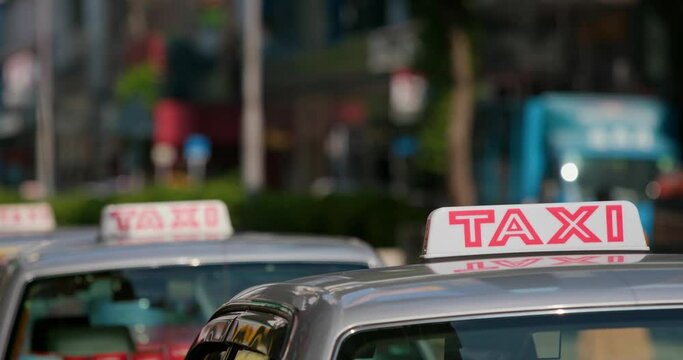 Taxi queue up in city street