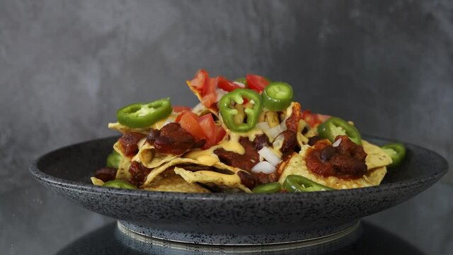 A Rotating Plate of Chili Cheese Nachos