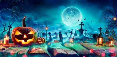 Foto auf Acrylglas Jack O’ Lantern On Table In Spooky Graveyard At Night - Halloween With Full Moon © Romolo Tavani