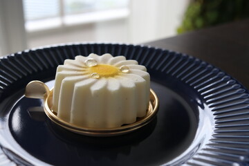a beautiful cake of white flower and rain drops