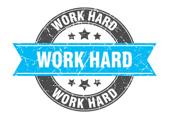 Fototapeta premium work hard round stamp with ribbon. label sign