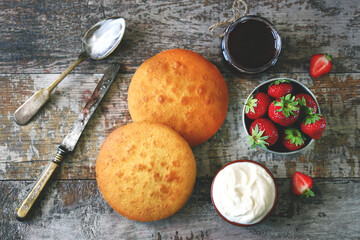 Selective focus. A set of products for making Victoria Sponge Cake. Strawberry pie recipe