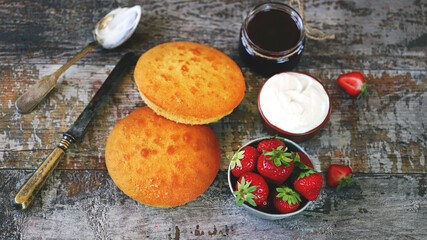 Selective focus. A set of products for making Victoria Sponge Cake. Strawberry pie recipe