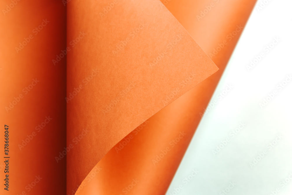 Fototapete Orange and white flat lay background with sharp layers, curves and shadows with copy space