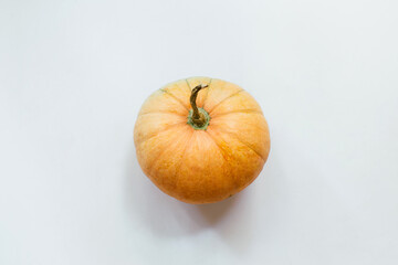 Pumpkin on white background. Halloween concept. Flat lay, top view
