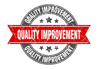 Obraz premium quality improvement round stamp with ribbon. label sign