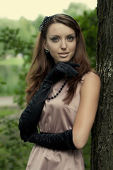 Naklejka premium beautiful vintage woman in summer park