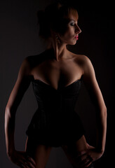 Naklejka premium Lingerie model over dark background