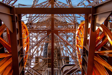 Fototapeta premium The big elevator wheels and metalwork of the Eiffel Tower