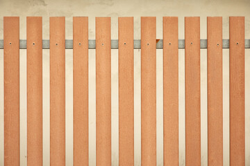 Close up and front view shot of wooden fence outside the house with loft concrete style wall shows beautiful texture and pattern of wood as abstract art which can be used as background