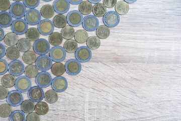 Top view coins on wood table