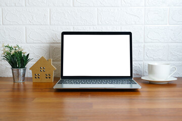 Workplace with laptop on table at home