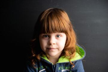 Portrait of cute little girl at home. Selective focus. 