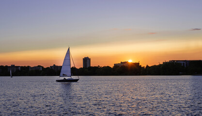 Sailing boats in the lake at sunset