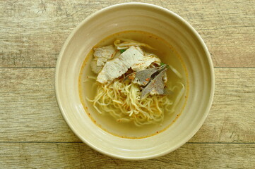Chinese egg yellow noodles topping slice boiled pork and spleen with soup in bowl - obrazy, fototapety, plakaty
