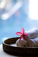 towel with flower on tray