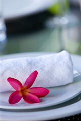 towel and flower on plate