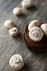 white mushrooms on wooden plate