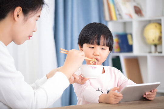 Oriental Girl Who Has Difficulty Eating