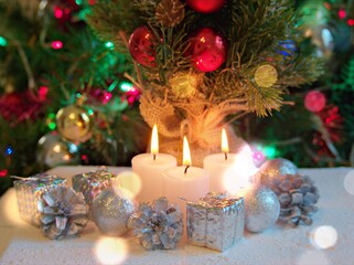 Merry christmas background tree with gifts and decorations for happy new year ,gift box, balls ,snow man, candle for celebration and card design