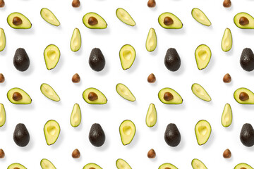 Avocado. Background made from isolated Avocado pieces on white background. Flat lay of fresh ripe avocados and avacado pieces.