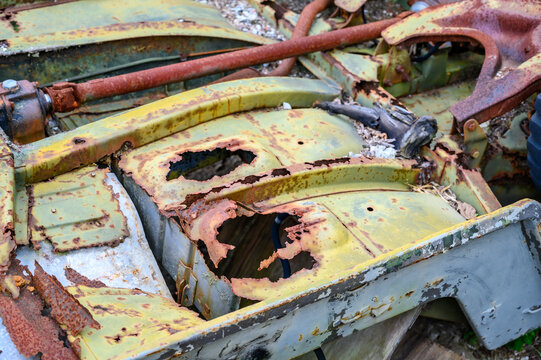 upside down rusted car chassis