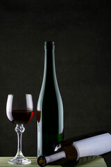 Still life with glasses of wine and glass bottle