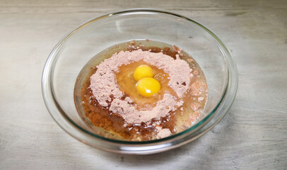 Brownie ingredients in bowl ready for mixing.