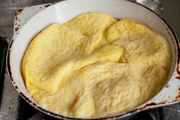 Appetizing omelette in frying pan