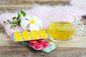 herbal healthy drinks hot honey lemon and lozenge for health care sore throat with lemon slice...