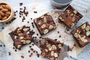 Brownies with almond slice on top and chocolate chips.