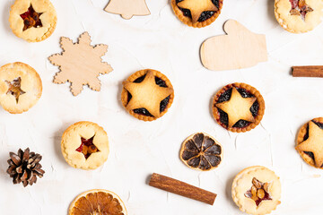 Christmas homemade mince pies flat lay on white cement background