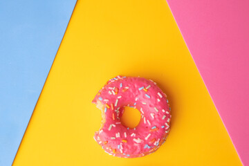pink donut on yellow background