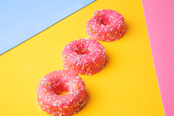 pink donut on yellow background
