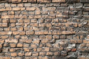  Old brick wall lined with curved bricks.