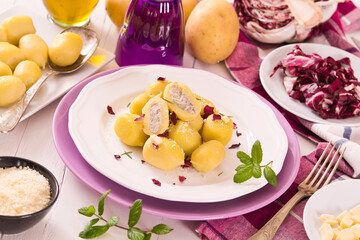 Potato gnocchi stuffed with radicchio and ricotta.