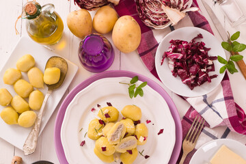 Potato gnocchi stuffed with radicchio and ricotta.