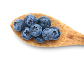 Tasty ripe blueberry in spoon on white background