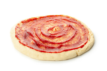 Rolled out pizza dough with sauce isolated on white background