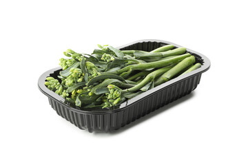 Plastic container with broccolini isolated on white background