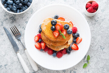 French wheat toast with fruit and honey isolated on a white background