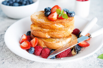 French wheat toast with fruit and honey isolated on a white background
