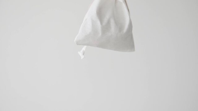 Two stylish bags with a sachet of dangling on a white background.
