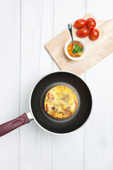 omelet in frying pan