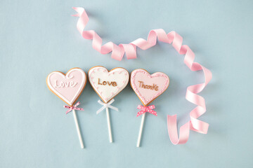 heart shaped icing cookies and ribbon