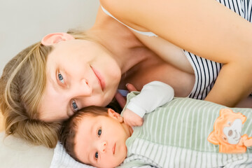 Obraz na płótnie Canvas Happy mother with newborn baby