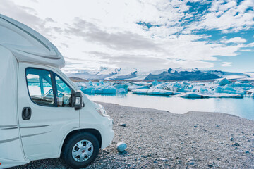Fototapeta na wymiar RV motorhome travel. Road trip in Iceland motorhome driving camping van on adventure vacation Jokulsarlon, Iceland.