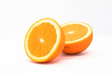 Two halves of orange on white background