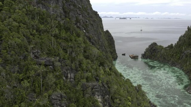 Raja Ampat, Misool, Palau Karawapop, Geosite, Love Lake Misool.  Aerial descending pan into lagoon.